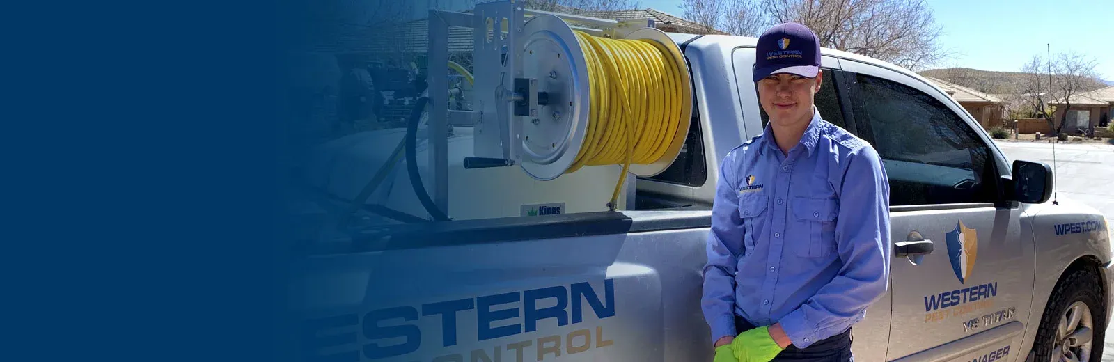 Employee in front of a work truck.